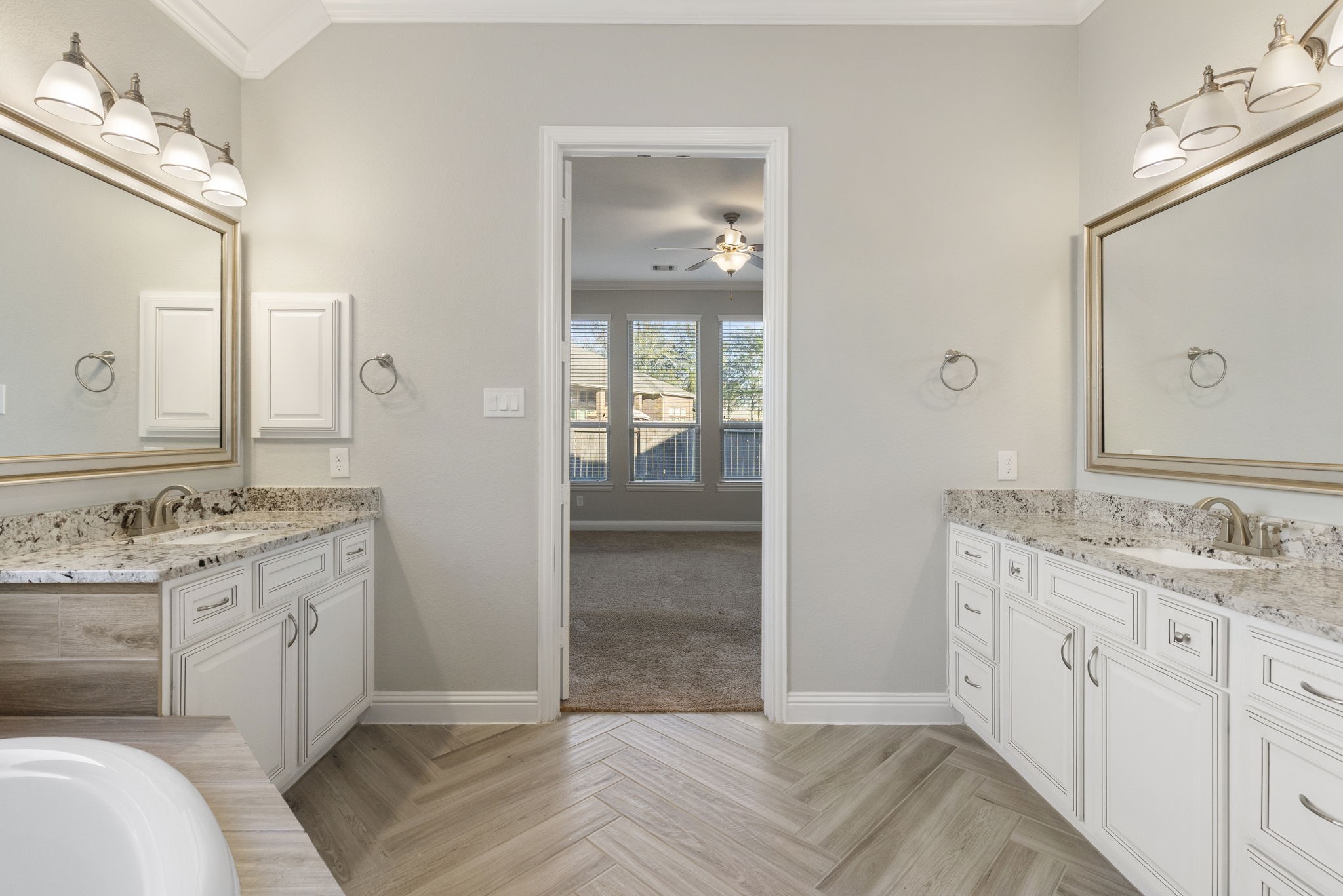 18855 Collins View Drive New Caney, TX 77357 - Photo 41 of 50 a spacious bathroom with a granite countertop sink and a mirror