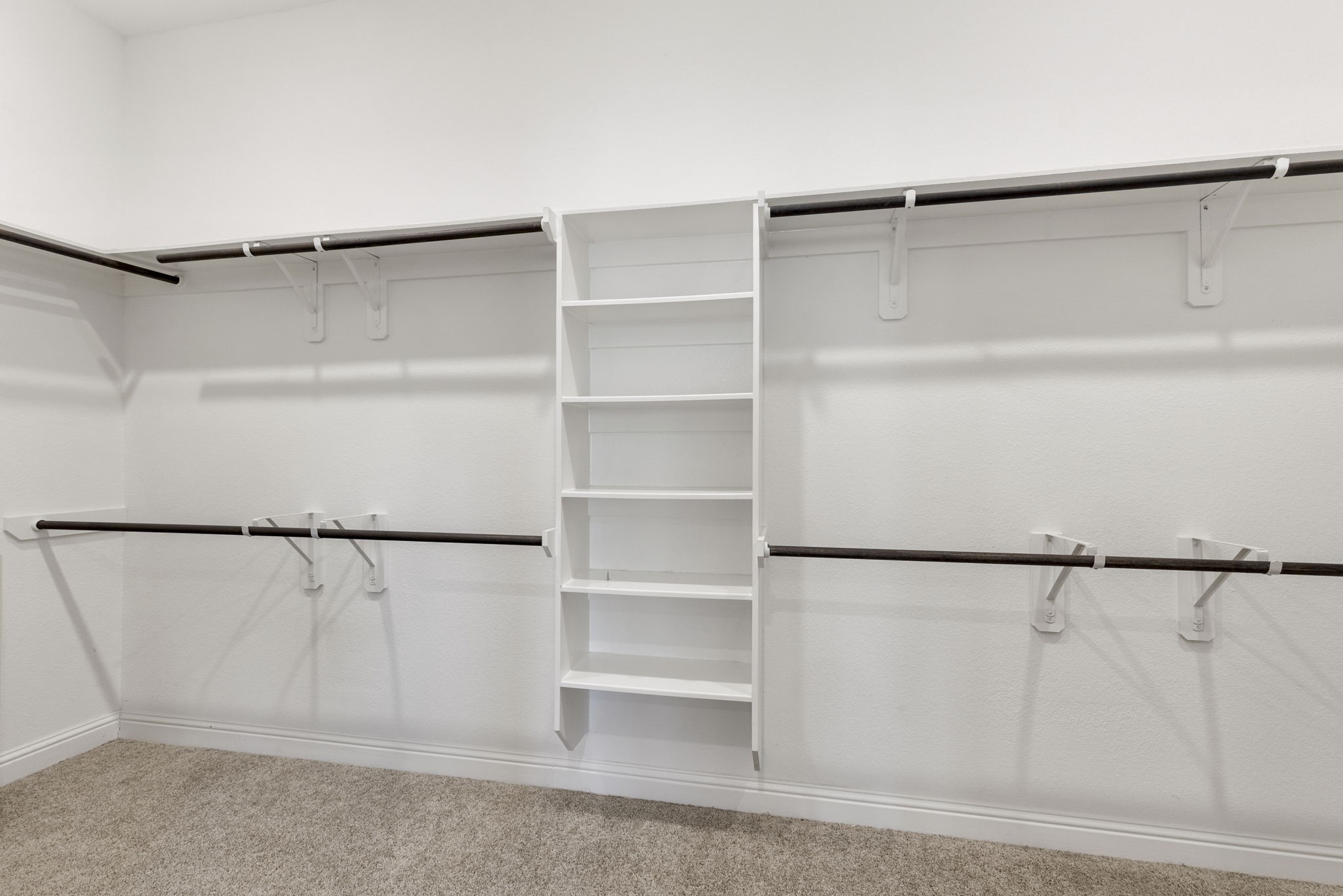 18855 Collins View Drive New Caney, TX 77357 - Photo 43 of 50 a view of walk in closet with empty racks