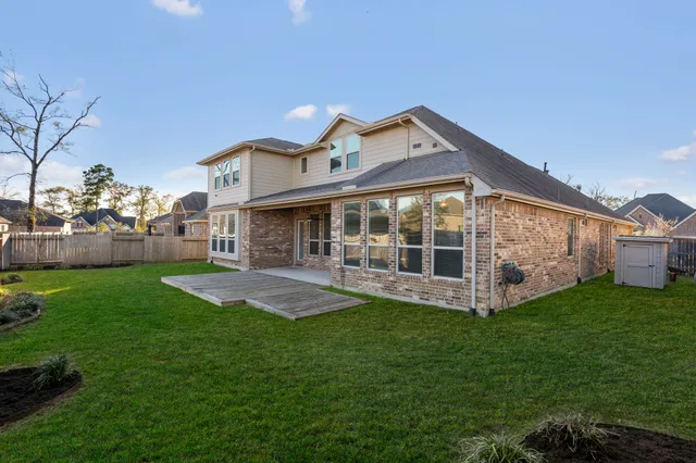 a front view of house with yard and outdoor seating