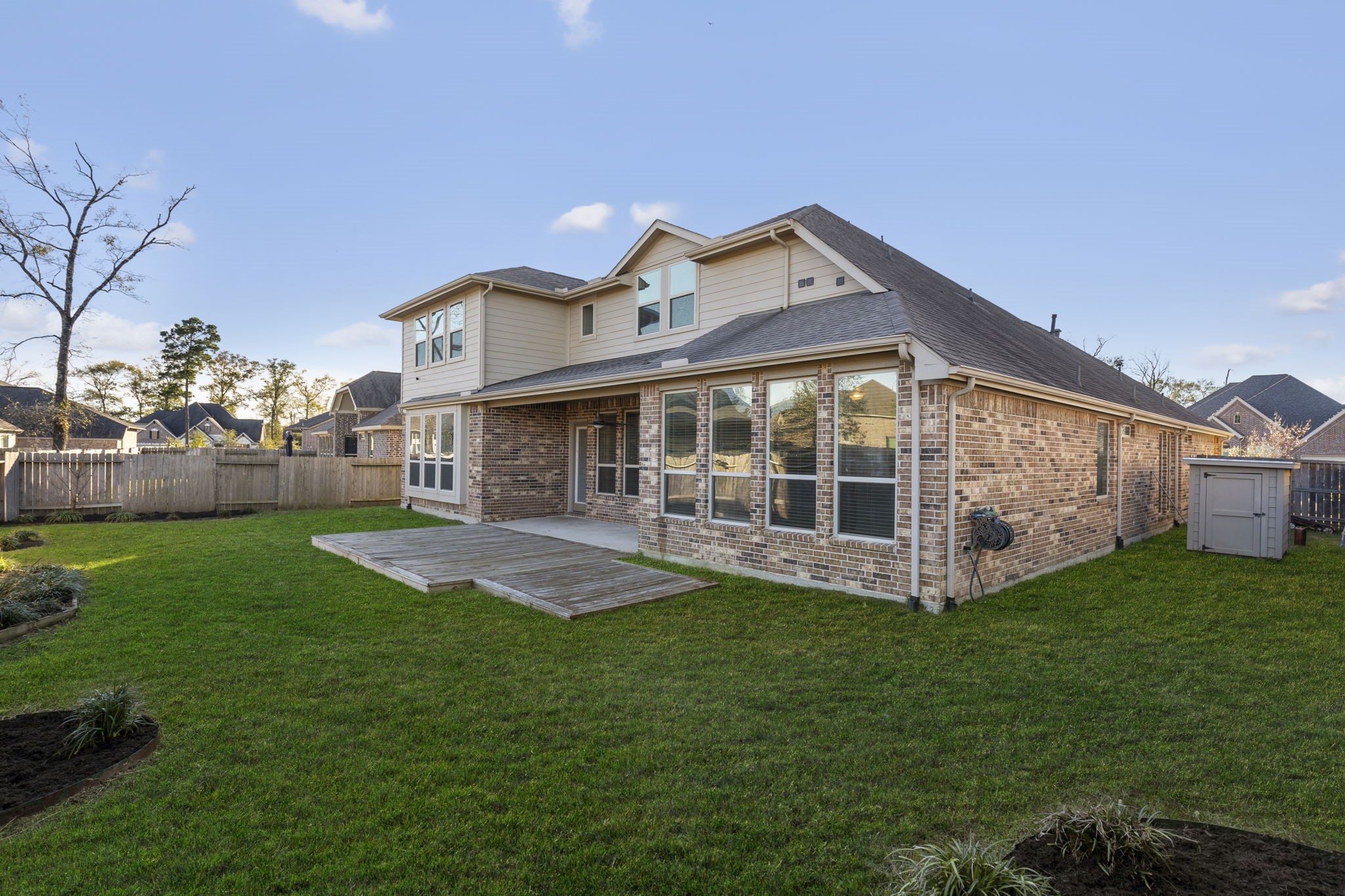 18855 Collins View Drive New Caney, TX 77357 - Photo 48 of 50 a front view of house with yard and outdoor seating