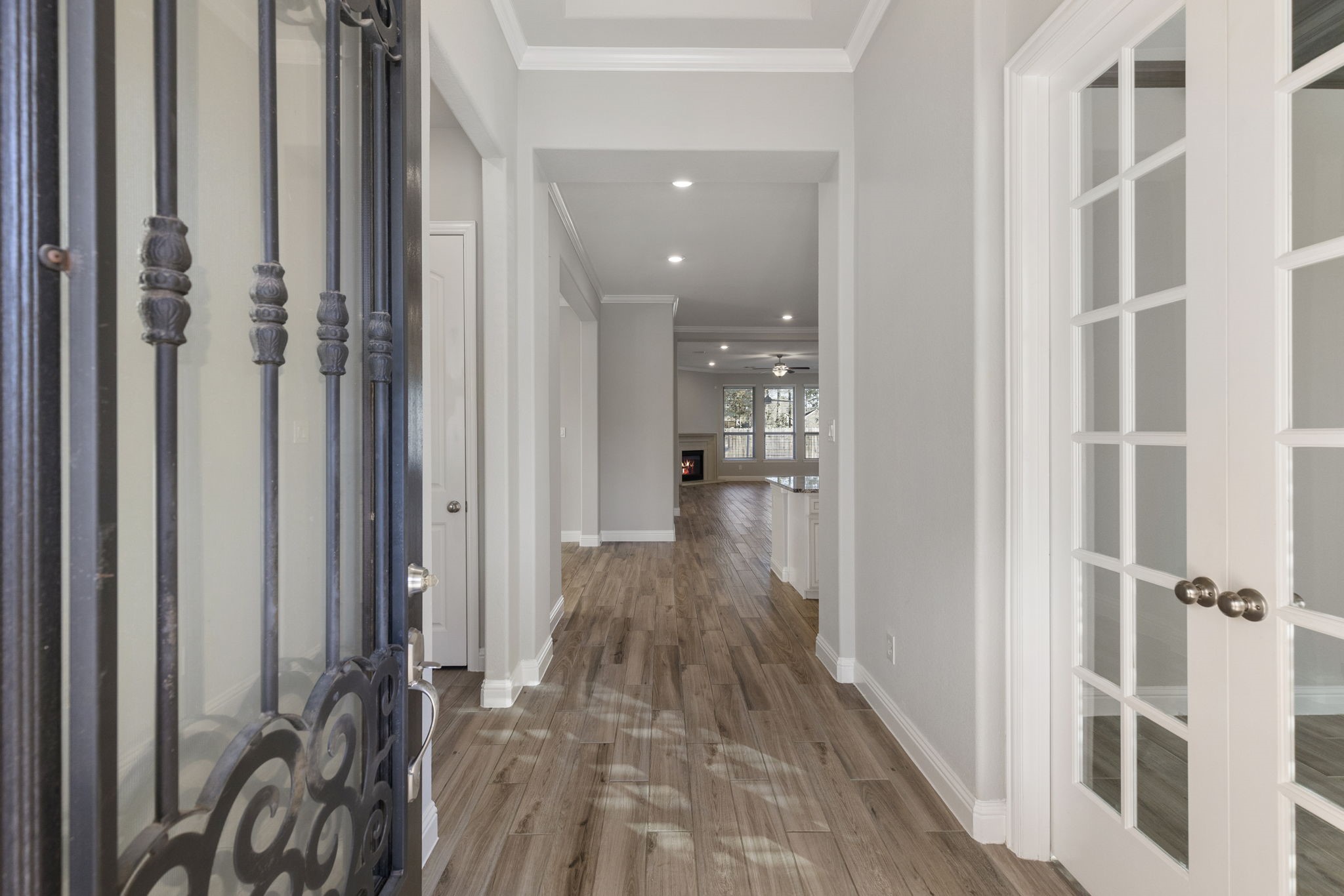 18855 Collins View Drive New Caney, TX 77357 - Photo 5 of 50 a view of a hallway with wooden floor and staircase