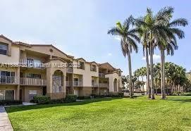 a view of multiple houses with a yard