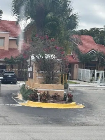 a view of a house with a swimming pool