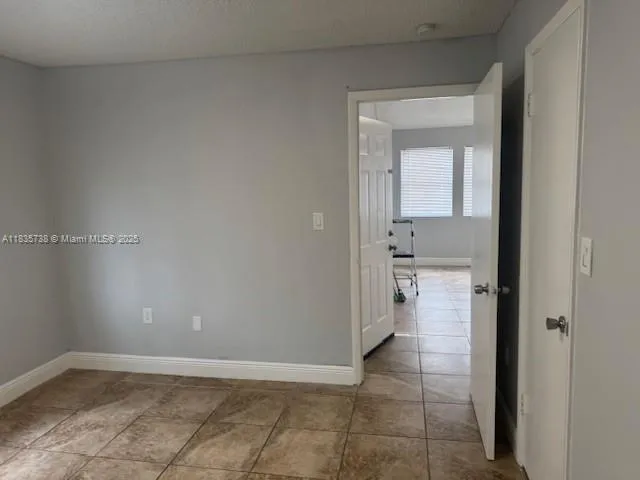 a view of a bathroom with a sink and a mirror