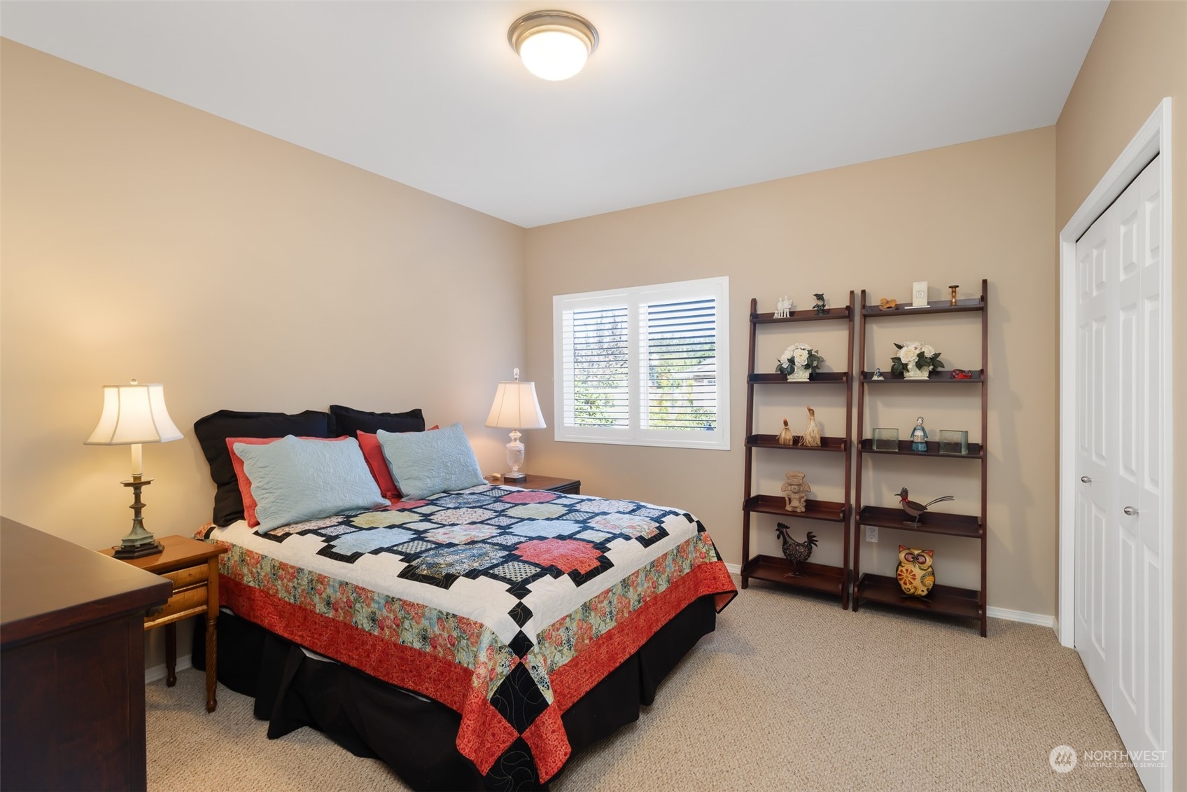 431 Blakely Boulevard Sequim, WA 98382 - Photo 19 of 34 a bedroom with a bed and a window