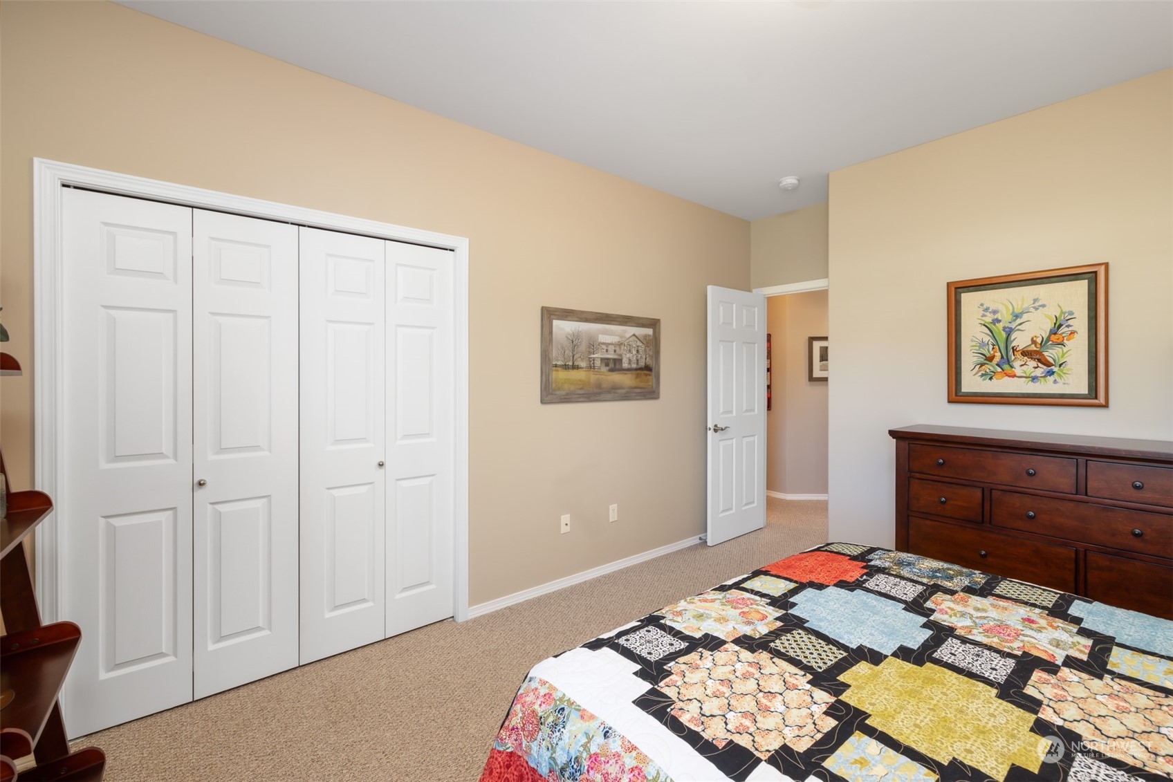 431 Blakely Boulevard Sequim, WA 98382 - Photo 20 of 34 a bedroom with a bed and a dresser
