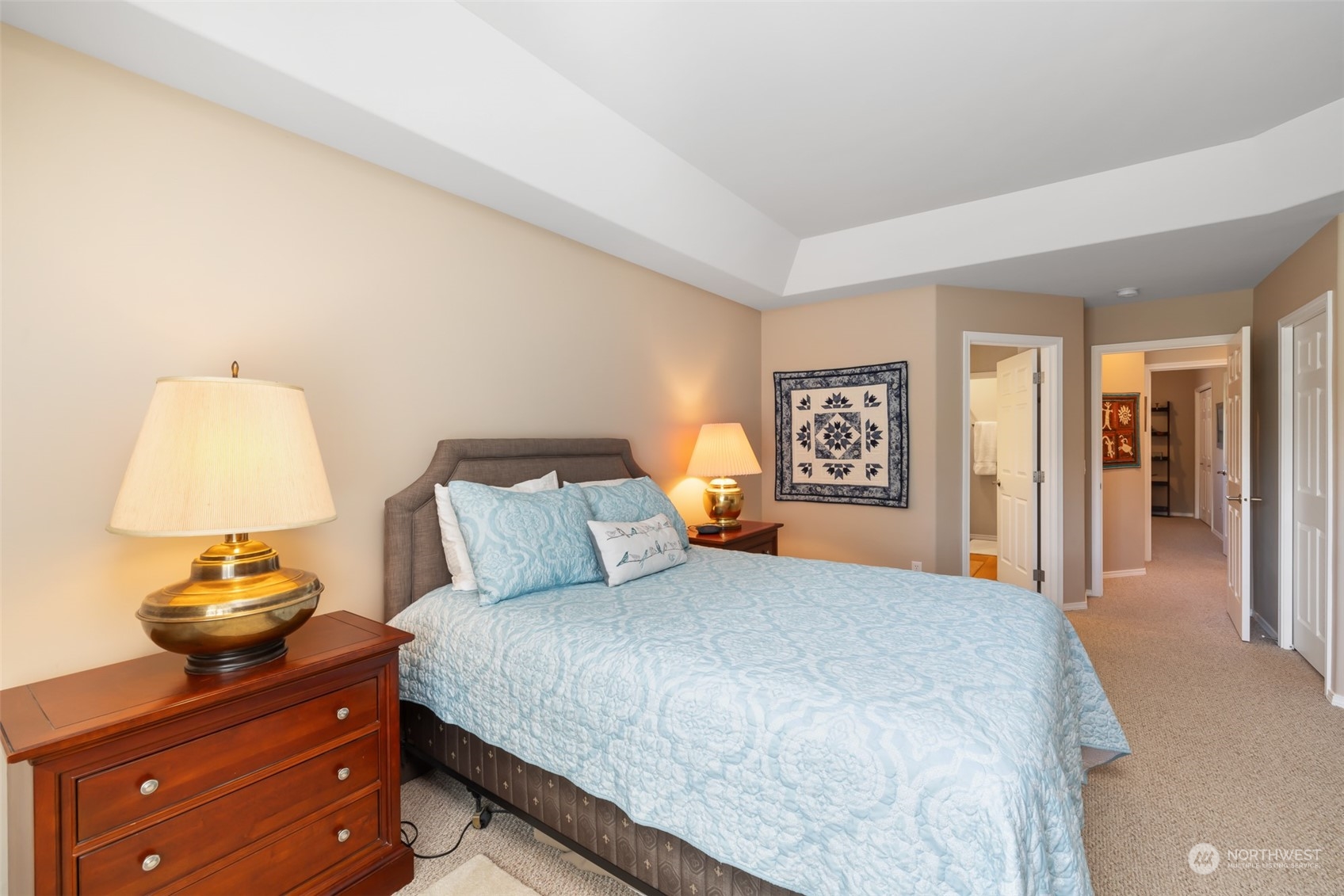 431 Blakely Boulevard Sequim, WA 98382 - Photo 24 of 34 a bedroom with a bed and lamp