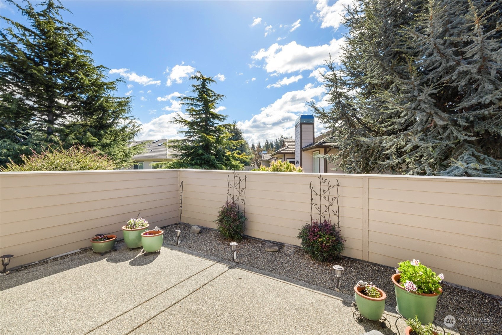 431 Blakely Boulevard Sequim, WA 98382 - Photo 29 of 34 a side view of a house with a yard
