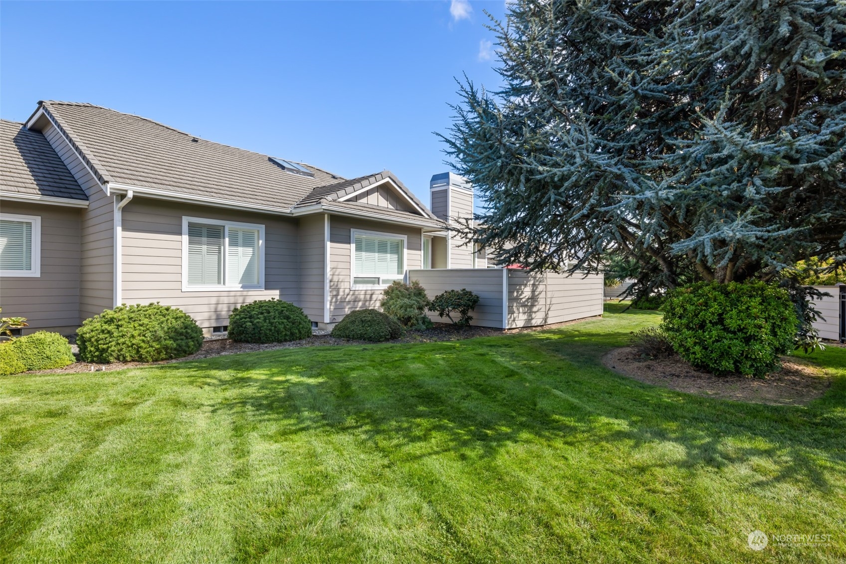 431 Blakely Boulevard Sequim, WA 98382 - Photo 30 of 34 a view of a house with a yard and plants