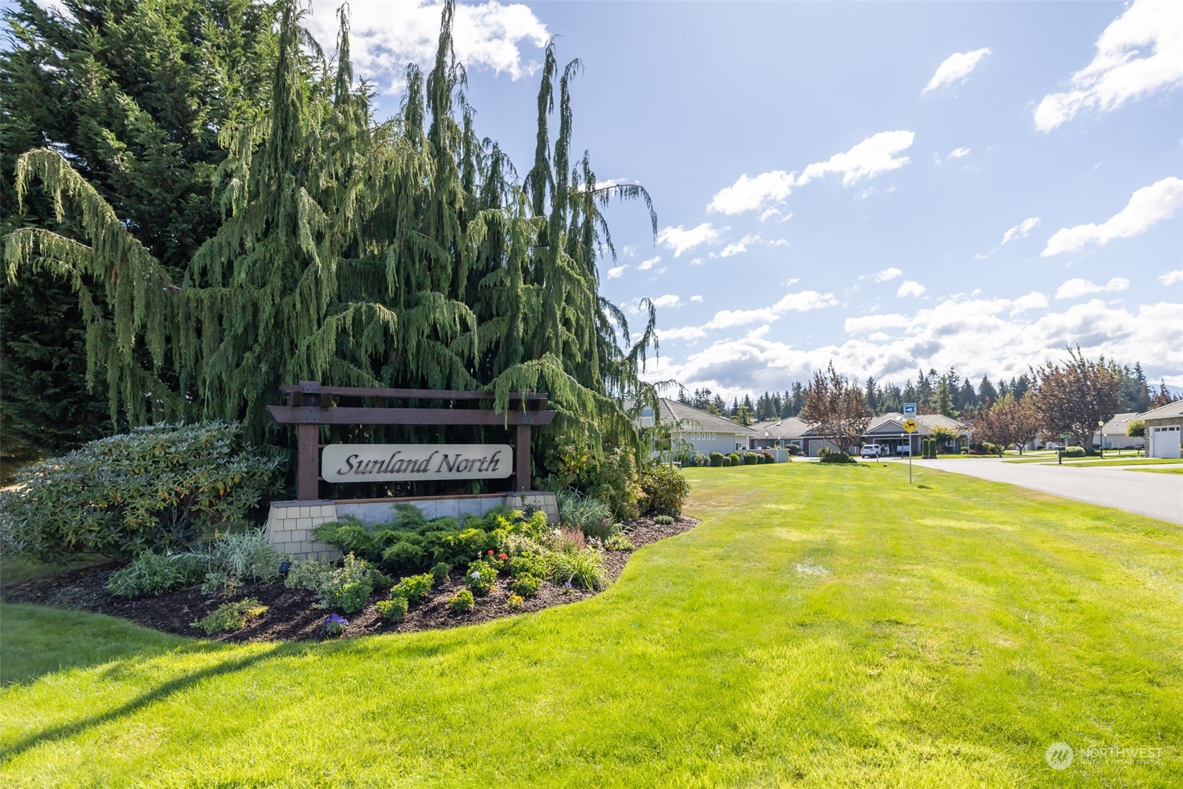 431 Blakely Boulevard Sequim, WA 98382 - Photo 34 of 34 a view of a swimming pool with a garden