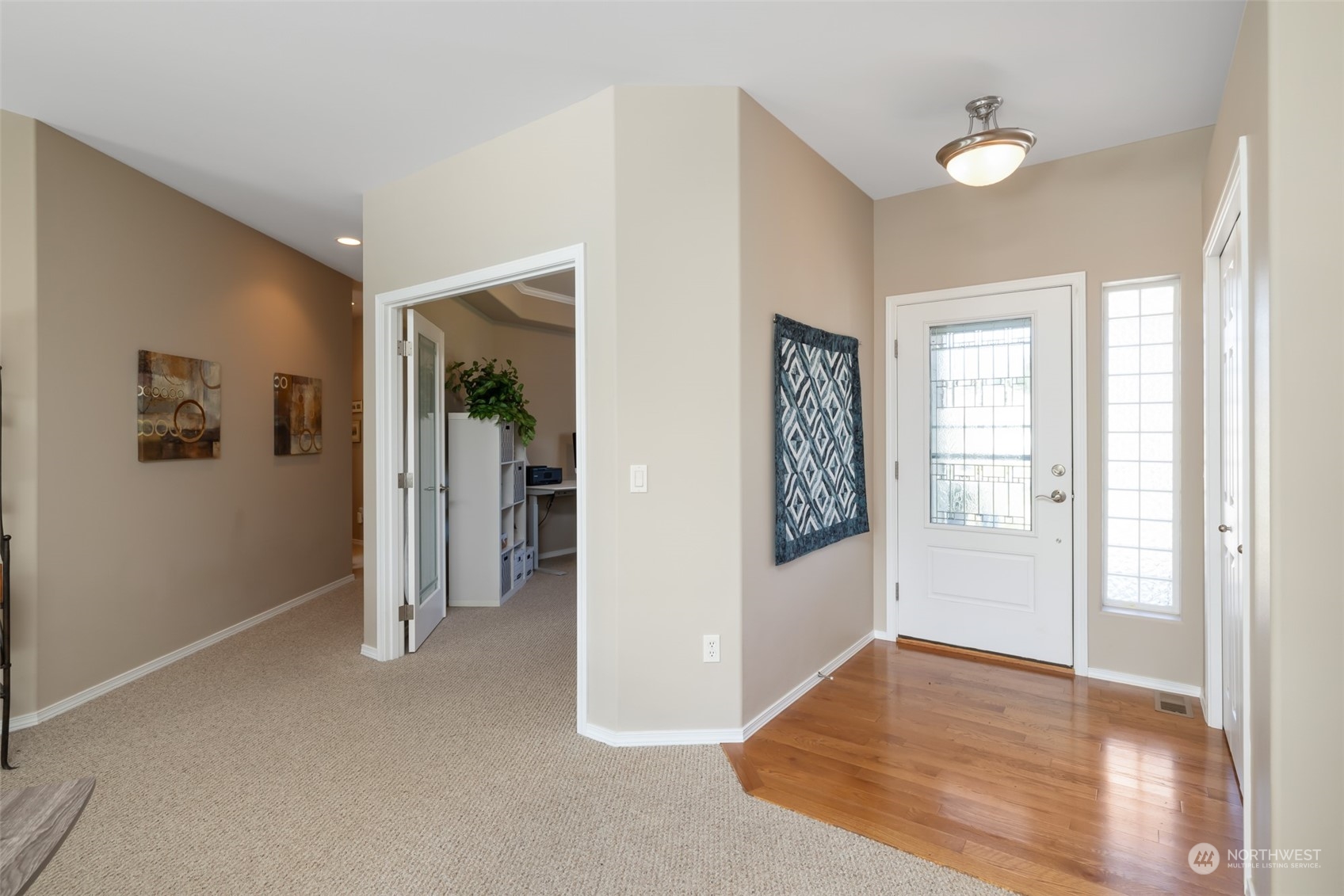 431 Blakely Boulevard Sequim, WA 98382 - Photo 6 of 34 wooden floor in an empty room with a window