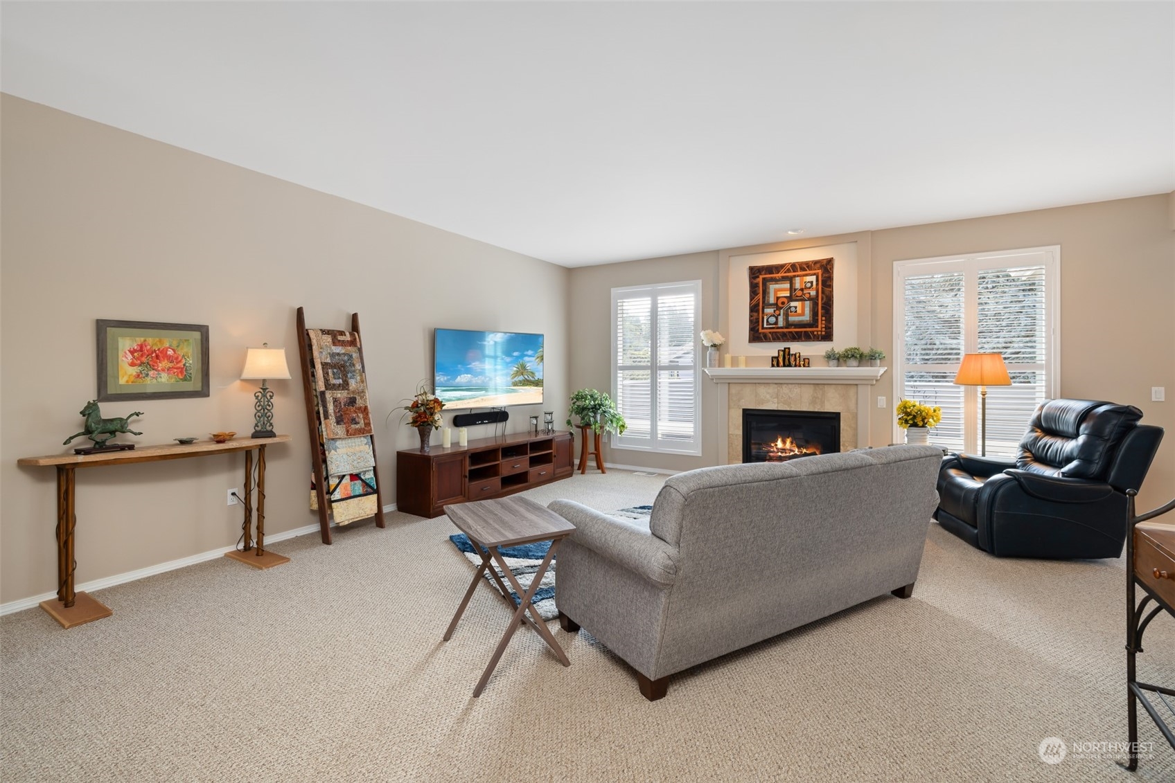 431 Blakely Boulevard Sequim, WA 98382 - Photo 8 of 34 a living room with furniture a fireplace and a flat screen tv