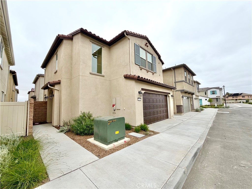 26893 Rubicon Road Menifee, CA 92586 - Photo 1 of 32 a view of a street with potted plants