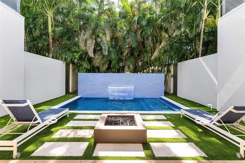 a view of swimming pool with chairs