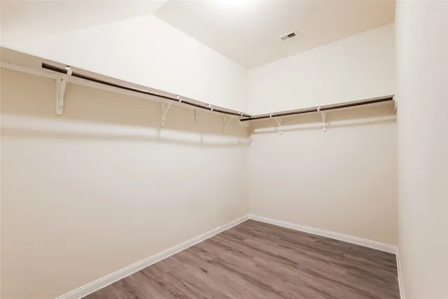a view of an empty walk in closet