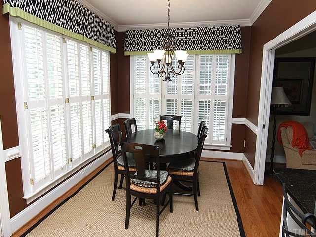 1909 Capers Court Raleigh, NC 27612 - Photo 7 of 15 Plantation shutters surround this wonderfully bright eat-in kitchen, with access to family room. Kitchen