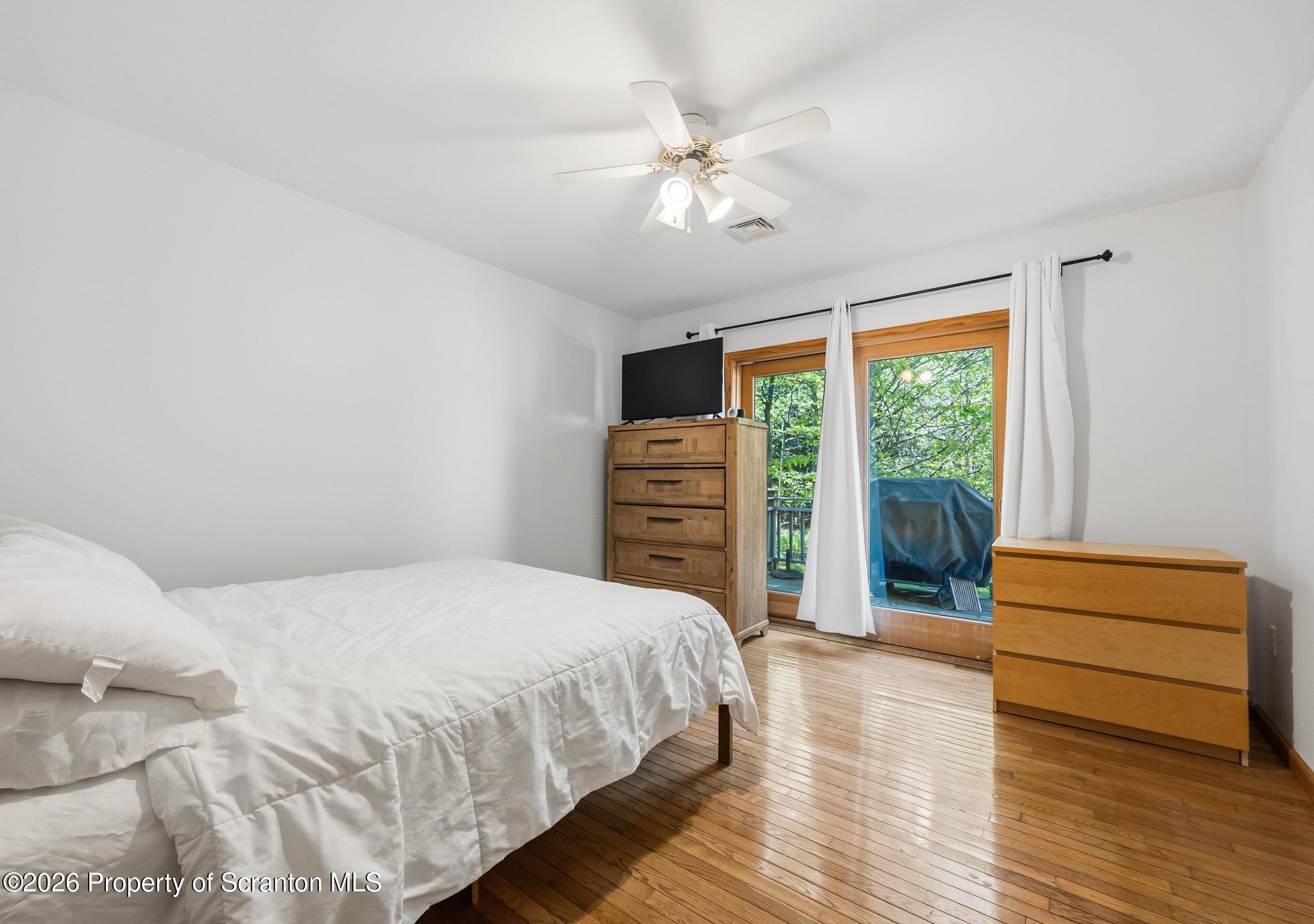 58 Bender Road Gouldsboro, PA 18424 - Photo 27 of 55 a bedroom with a bed and a window