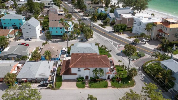 an aerial view of multiple houses with yard