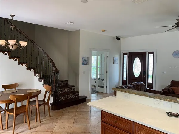 a view of a hallway with furniture and entryway