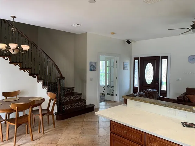 a view of a hallway with furniture and entryway