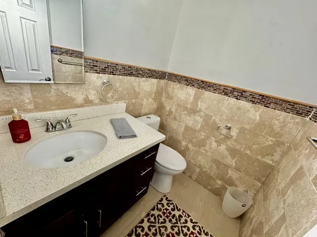 a bathroom with a sink and a toilet