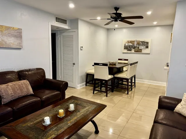 a living room with furniture and a rug