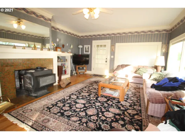 a living room with a couch and a fireplace