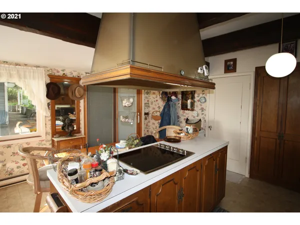 a kitchen view of a dining table and chairs