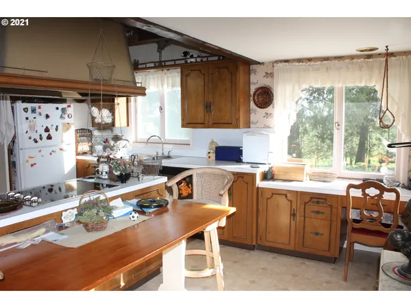 a kitchen with stainless steel appliances granite countertop a sink and a stove