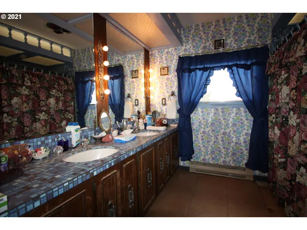 a bathroom with sinks and a large mirror