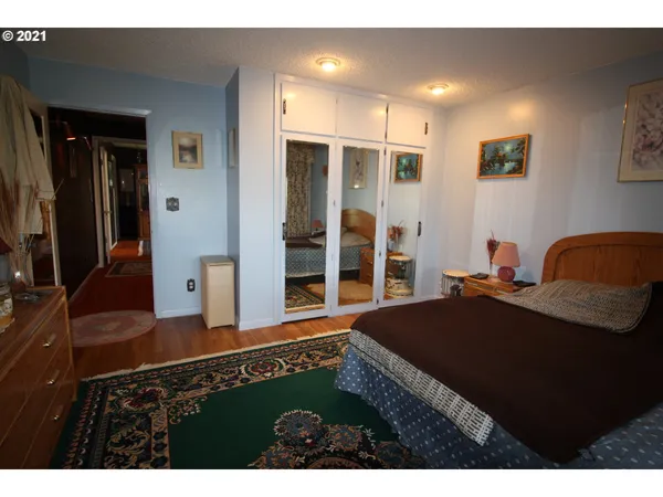 a bedroom with furniture and a walk in closet