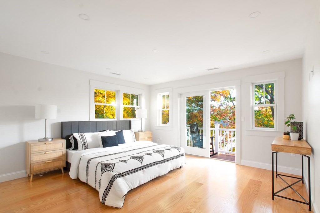 90 Evergreen Road Natick, MA 01760 - Photo 14 of 22 a spacious bedroom with a bed and glass windows