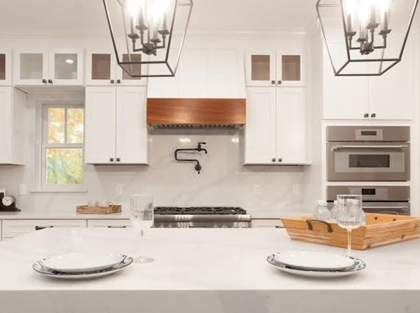 90 Evergreen Road Natick, MA 01760 - Photo 19 of 22 a kitchen with stainless steel appliances granite countertop a sink and a stove
