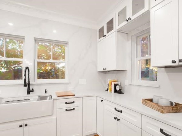 90 Evergreen Road Natick, MA 01760 - Photo 20 of 22 a kitchen with stainless steel appliances white cabinets and a window