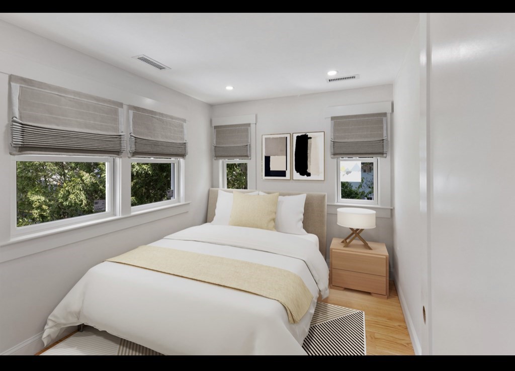 90 Evergreen Road Natick, MA 01760 - Photo 3 of 22 a bedroom with a large bed and a large window