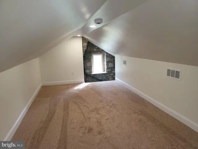 a view of a park with large trees