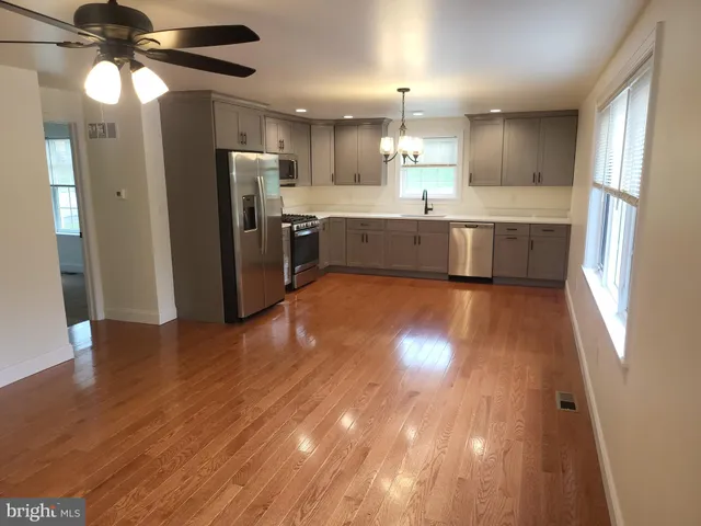 a view of kitchen with wooden floor
