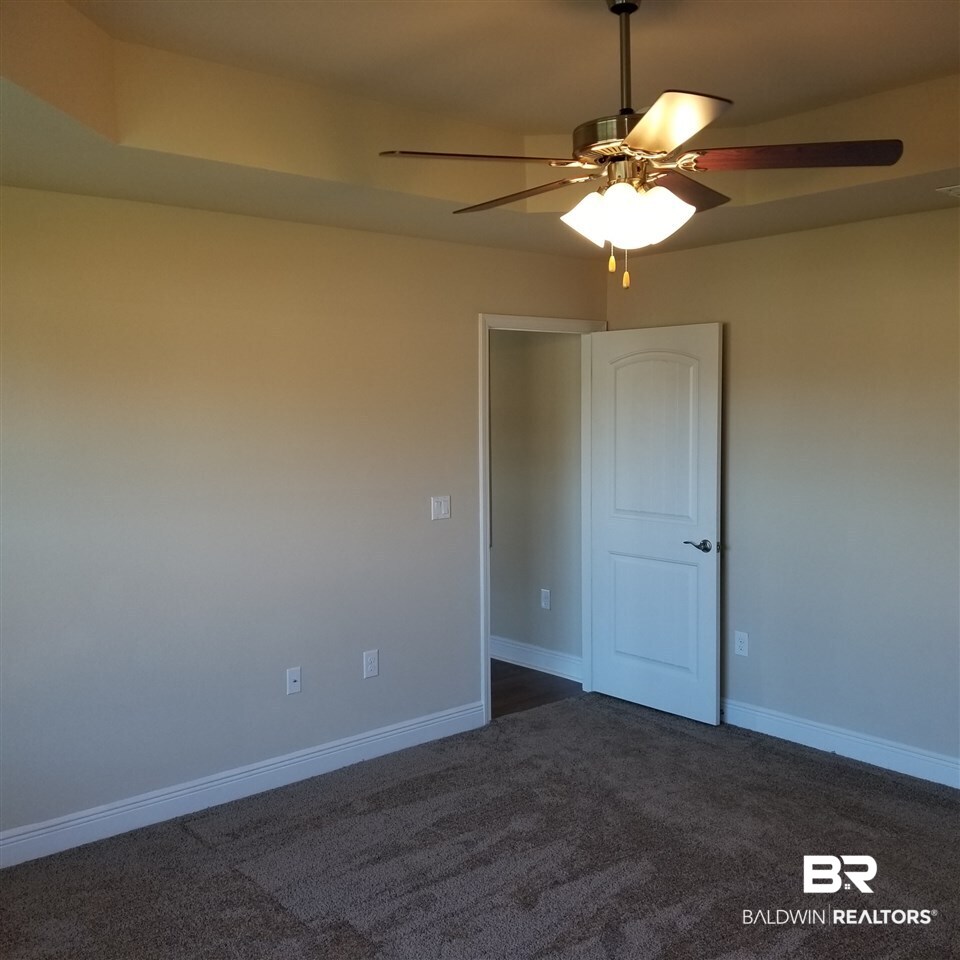 14606 Troon Drive Foley, AL 36535 - Photo 14 of 18 Large windows, tray ceiling, fan with lights
