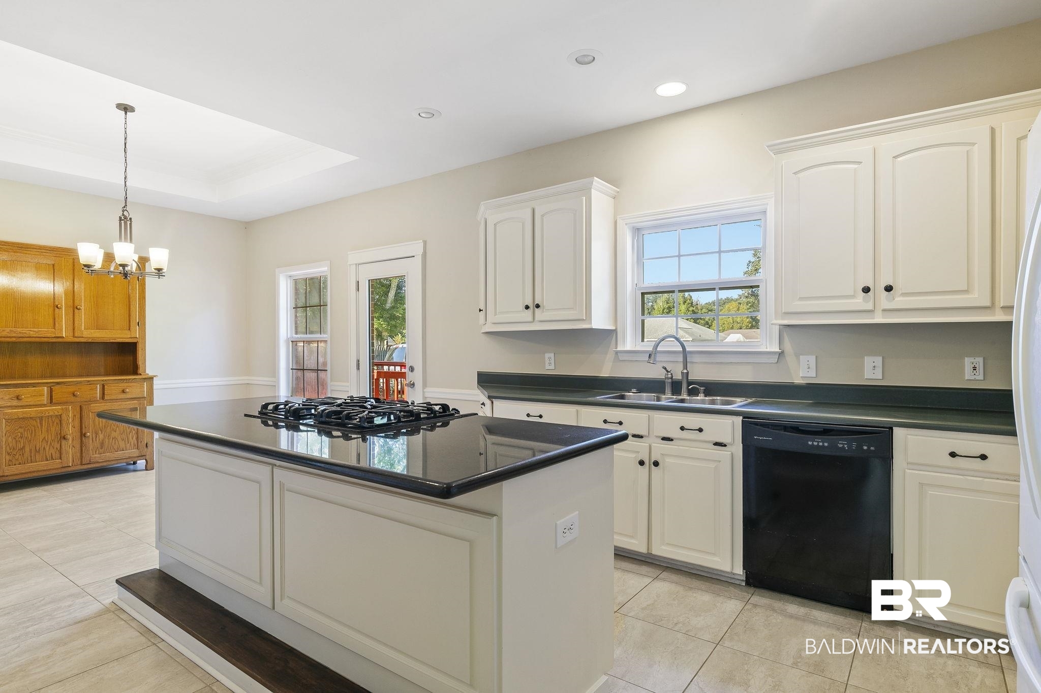 9631 Bay Meadows Avenue Fairhope, AL 36532 - Photo 14 of 49 Kitchen featuring a center island, white cabinets, sink, black dishwasher, and gas cooktop
