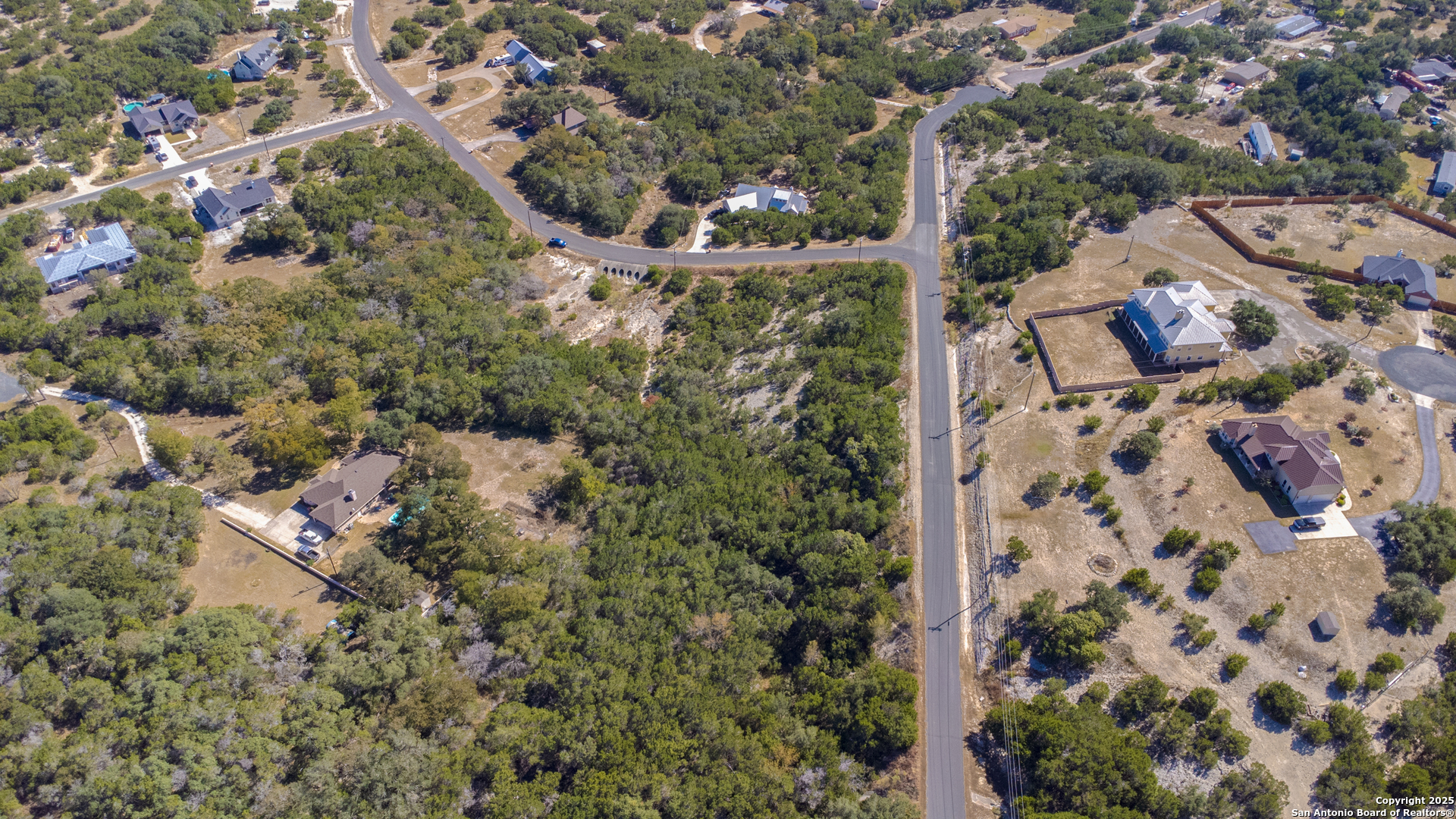0 Tbd- Stallion Estates Spring Branch, TX 78070 - Photo 4 of 9 an aerial view of residential house with outdoor space and trees all around