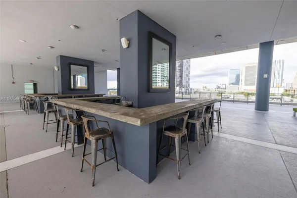 a view of a dining room with furniture and window