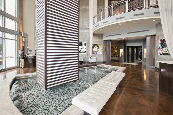 a view of a patio with table and chairs