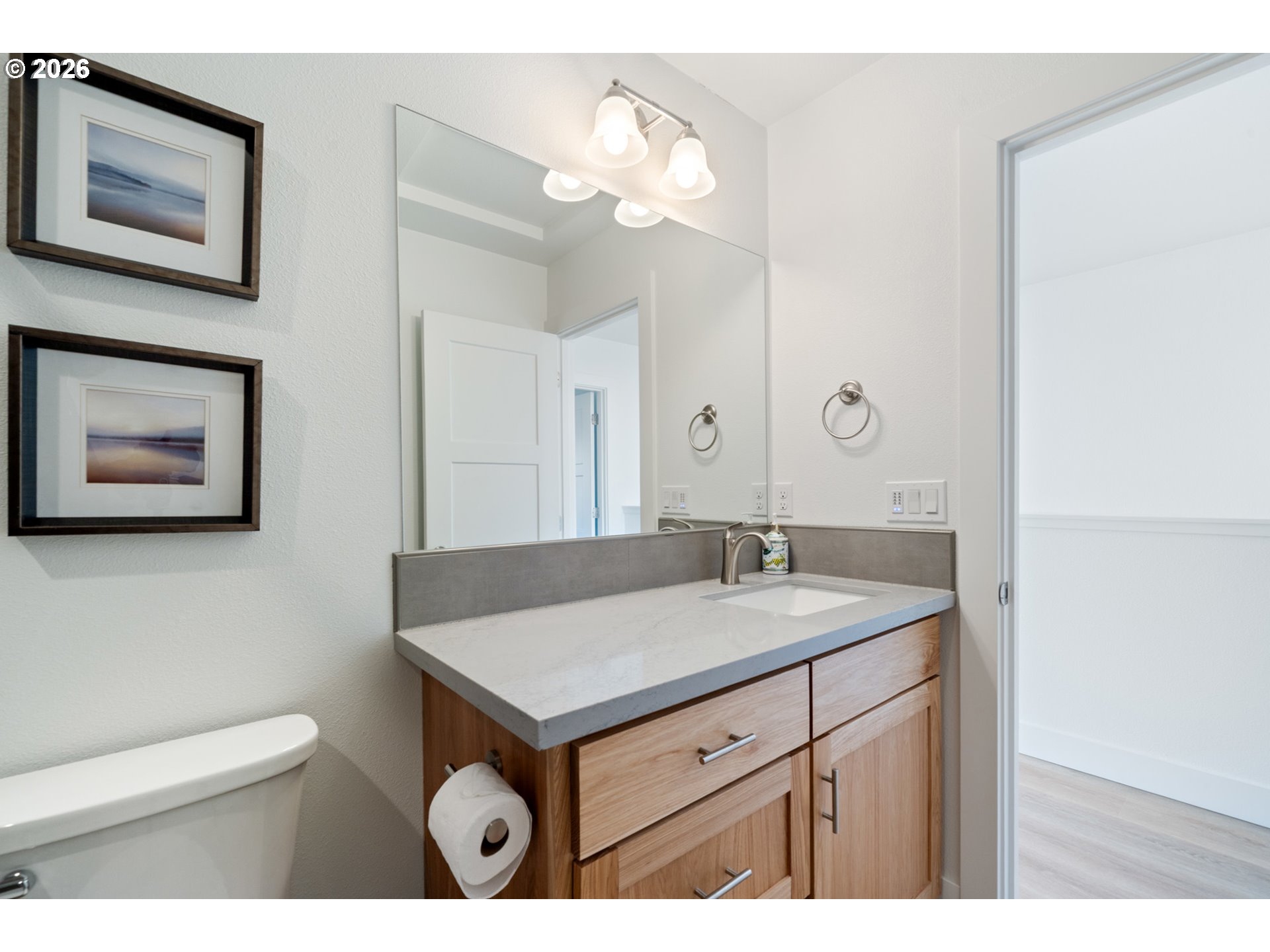 120 Reeder Street Tillamook, OR 97141 - Photo 22 of 41 a bathroom with a sink a vanity and a toilet