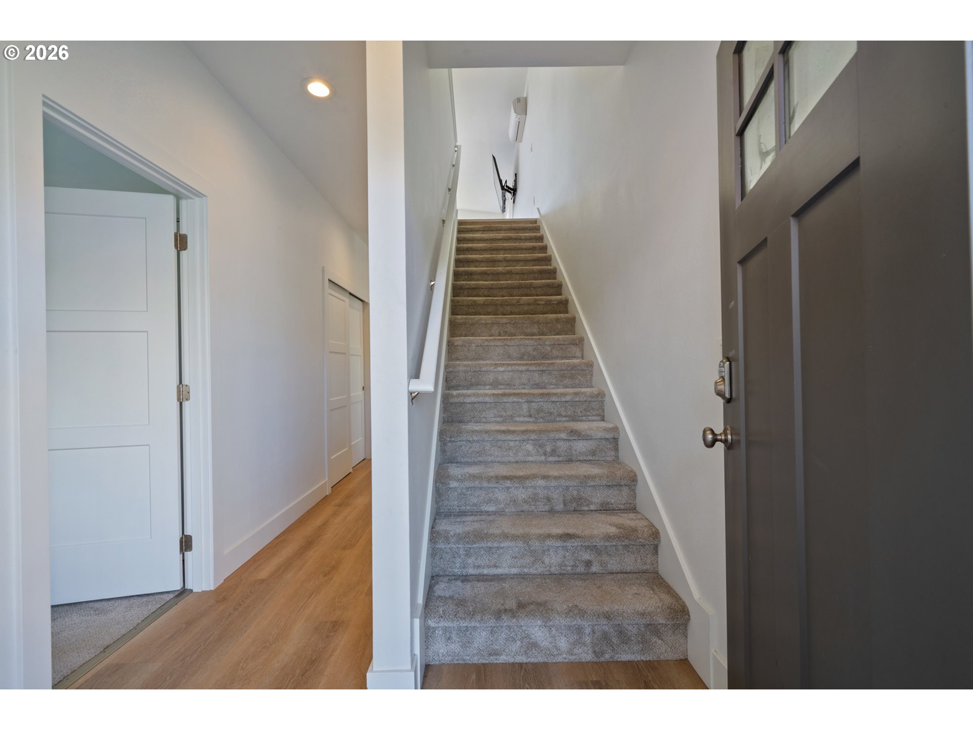 120 Reeder Street Tillamook, OR 97141 - Photo 26 of 41 a view of a hallway with wooden floor and stairs