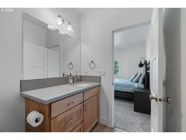a en suite bathroom with a sink and mirror