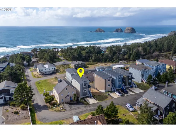an aerial view of a house with a swimming pool yard and mountain view in back