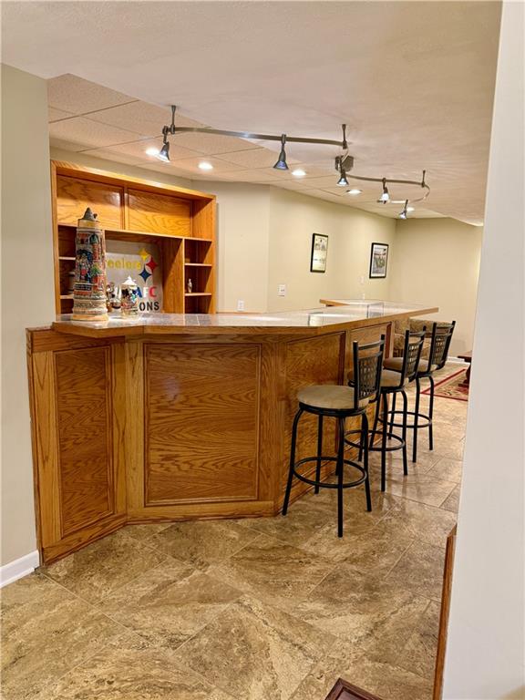 293 Sandy Hill Road Valencia, PA 16059 - Photo 46 of 50 a view of a kitchen with kitchen island a table and chairs in it