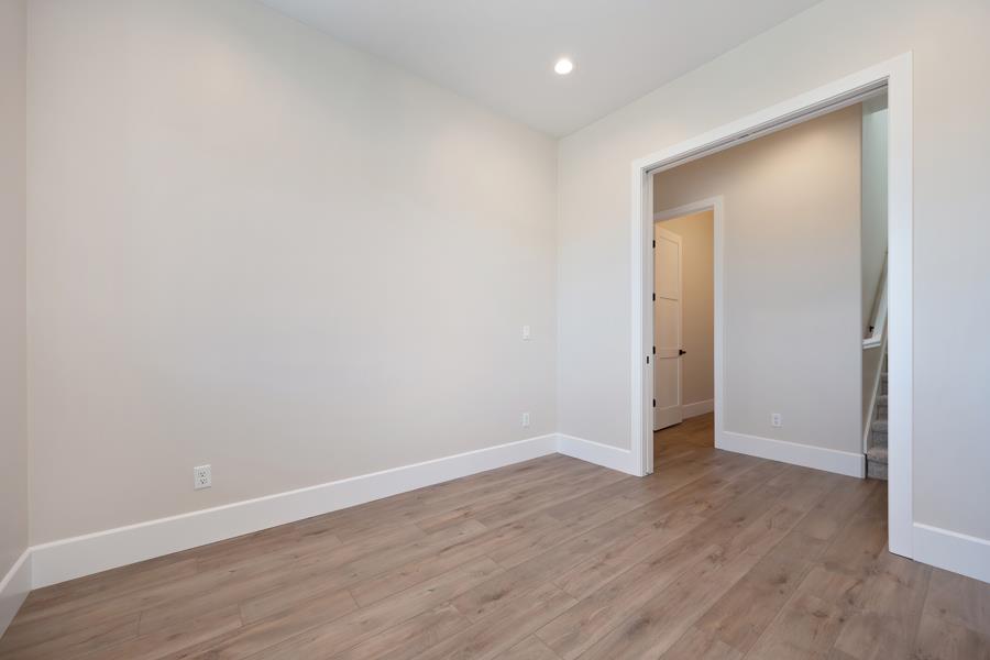 3301 Stone Field Way Loomis, CA 95650 - Photo 16 of 33 a view of an empty room with wooden floor