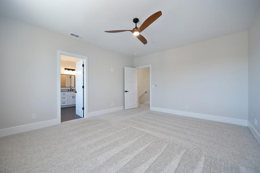 3301 Stone Field Way Loomis, CA 95650 - Photo 17 of 33 a view of an empty room with a ceiling fan