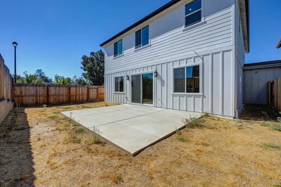 3301 Stone Field Way Loomis, CA 95650 - Photo 2 of 33 a view of a white house with a backyard space